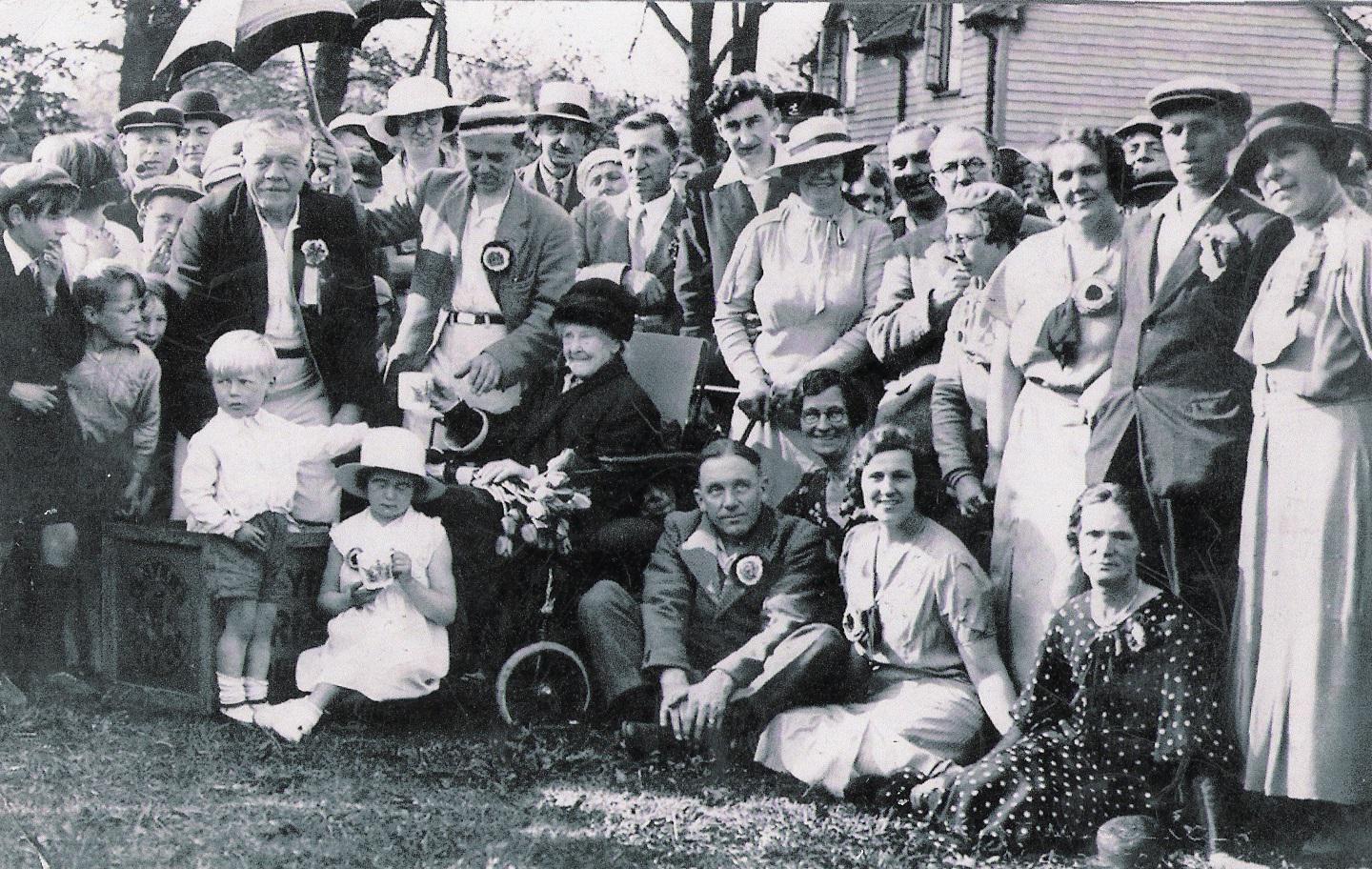 1935 - Mrs Mary Penfold presents Jubilee Mugs to school children_